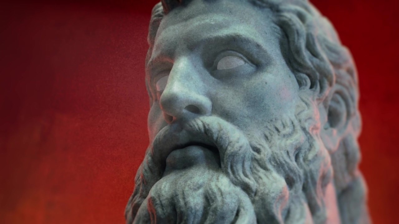 Plan final : le visage de Zeus, marbre érodé sur fond rouge